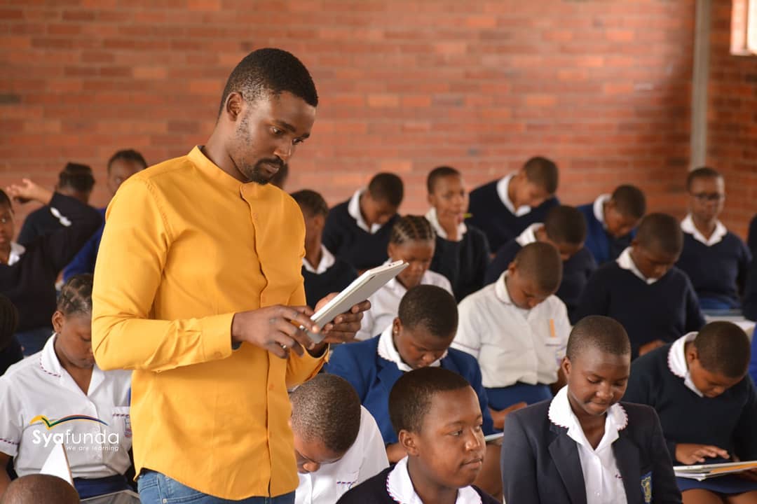 Educator with students